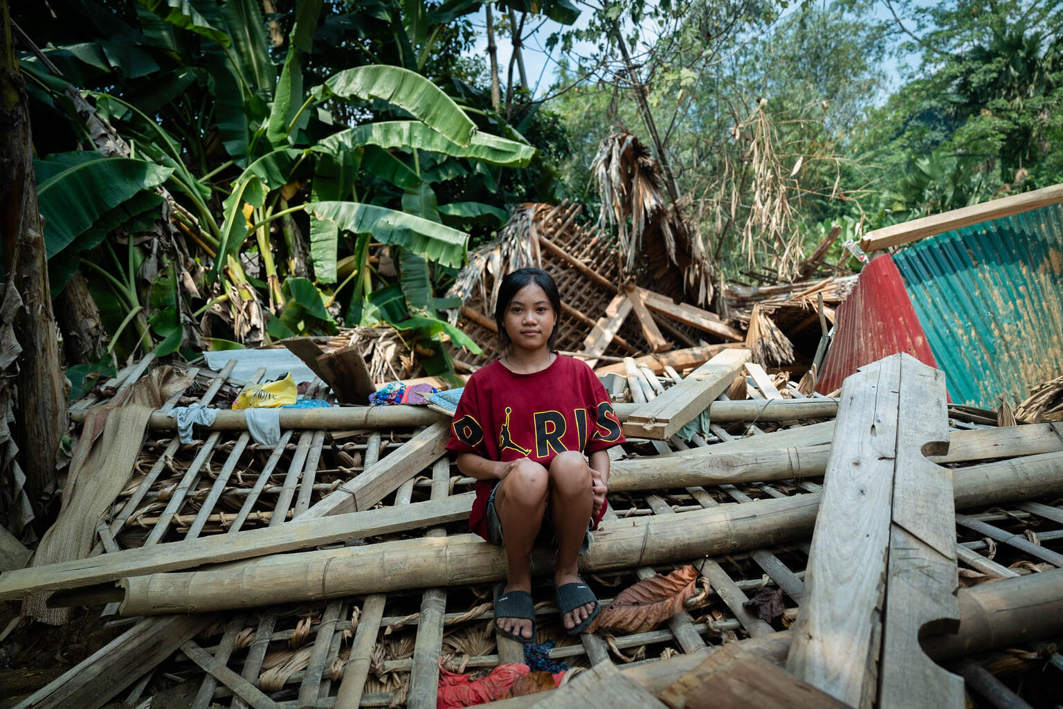 13-year-old girls sits on the ruins of a house destroyed by a landslide caused by Typhoon Yagi in Thuong village, Yen Bai province. On 7 September 2024, Super Typhoon Yagi, the strongest storm in Viet Nam in 70 years, made landfall, affecting 14 northern provinces and impacting the lives of millions of children and families.